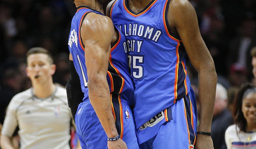 Oklahoma City Thunder&#39;s Kevin Durant, right, and Russell Westbrook celebrate their team&#39;s 100-99 win over the Los Angeles Clippers in an NBA basketball game, Monday, Dec. 21, 2015, in Los Angeles. (AP Photo/Jae C. Hong)