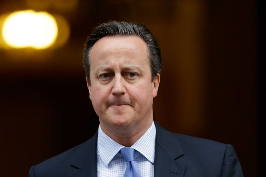 FILE - In this Wednesday, Dec. 2, 2015 file photo, British Prime Minister David Cameron leaves 10 Downing Street in London, to go to the Houses of Parliament. Prime Minister David Cameron's office says he will look into a lawmaker's claim that U.S. officials prevented a British Muslim family from flying to Disneyland for a planned holiday on Dec. 15, 2015. (AP Photo/Matt Dunham, File)