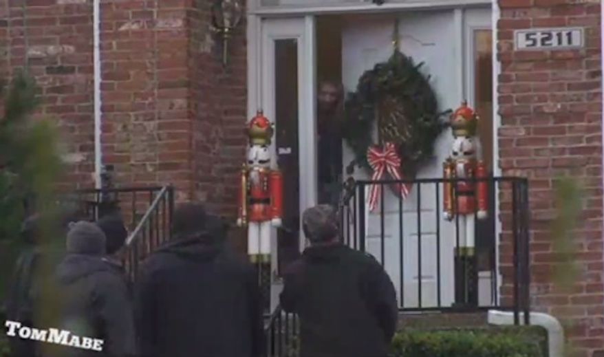 A series of prank videos showing a group of large black men singing Christmas carols in wealthy Louisville neighborhoods is going viral. (WDRB)