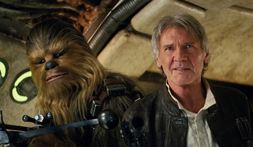 This photo provided by Lucasfilm shows Peter Mayhew as Chewbacca and Harrison Ford as Han Solo in "Star Wars: The Force Awakens," directed by J.J. Abrams. The movie opened in U.S. theaters on Dec. 18, 2015. (Film Frame/Lucasfilm via AP) -