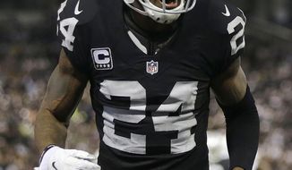 Oakland Raiders cornerback Charles Woodson (24) reacts during the first half of an NFL football game against the San Diego Chargers in Oakland, Calif., Thursday, Dec. 24, 2015. (AP Photo/Marcio Jose Sanchez)