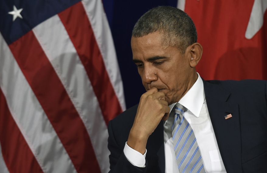 FILE - In this Nov. 19, 205 file photo, President Barack Obama listens as Canada's Prime Minister Justin Trudeau speaks during their bilateral meeting at the Asia-Pacific Economic Cooperation summit in Manila, Philippines. (AP Photo/Susan Walsh, File)