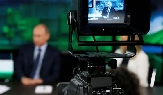 As Russian President Vladimir Putin visits the headquarters of RT, U.S. lawmakers are concerned how Moscow has brought about a propaganda revolution in which America&#39;s government-financed news operations have remained largely stagnant in global reach. (Associated Press)
