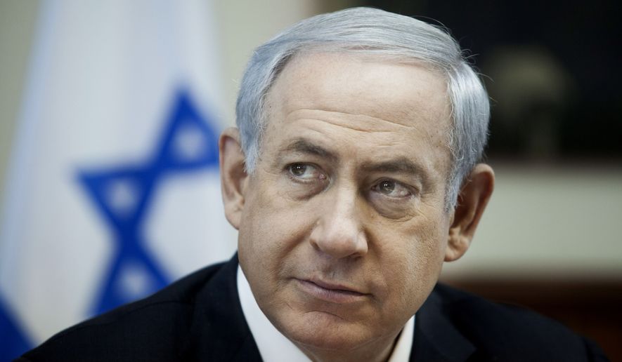 Israeli Prime Minister Benjamin Netanyahu listens during the weekly cabinet meeting in Jerusalem , Sunday, Dec. 27, 2015. (Dan Balilty/Pool Photo via AP)