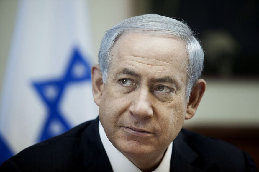 Israeli Prime Minister Benjamin Netanyahu listens during the weekly cabinet meeting in Jerusalem , Sunday, Dec. 27, 2015. (Dan Balilty/Pool Photo via AP)