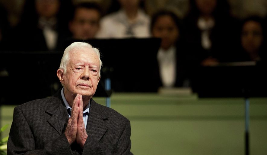 In a Sunday, Aug. 23, 2015 file photo, former President Jimmy Carter teaches Sunday School class at Maranatha Baptist Church in his hometown, in Plains, Ga. Carter&#39;s battle with cancer, which put a spotlight on his faith and led to an outpouring of support, is among the state&#39;s top stories of 2015. (AP Photo/David Goldman, File)