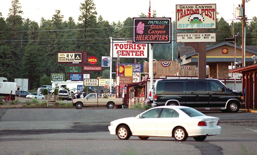 FILE - This August 2009 file photo shows Tusayan, Ariz., a tiny town on the road to the Grand Canyon's South Rim. The tiny town outside the canyon that has big plans for development will be under new leadership in 2016. Greg Bryan, Tusayan's first mayor selected by colleagues on the Town Council shortly after it incorporated in 2010, is leaving the office Dec. 31, 2015, to spend more time with family. (Jake Bacon/Arizona Daily Sun via AP, File) MANDATORY CREDIT
