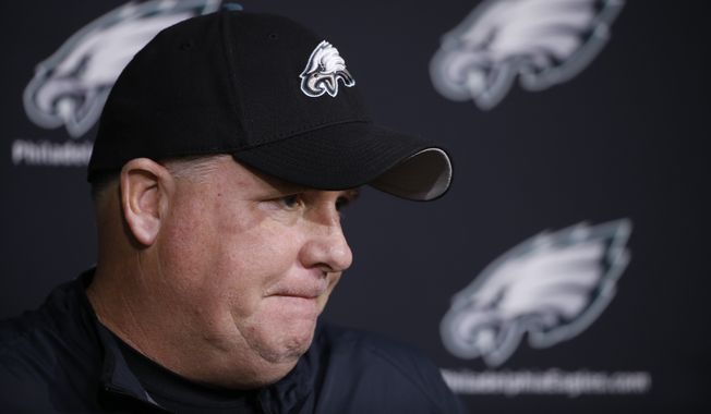 Philadelphia Eagles head coach Chip Kelly listens to a question during a news conference at the team&#x27;s practice facility Monday in Philadelphia. (Associated Press)
