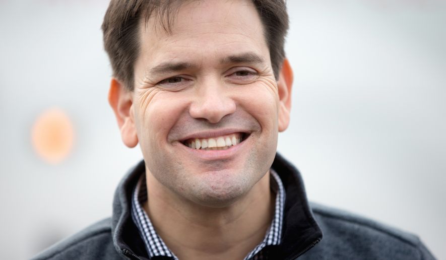 Republican presidential candidate, Sen. Marco Rubio, R-Fla. smiles as he talks to members of the media following his speaking at Rastrelli&#39;s Tuscany Special Events Center in Clinton, Iowa, Tuesday, Dec. 29, 2015. (AP Photo/Andrew Harnik)