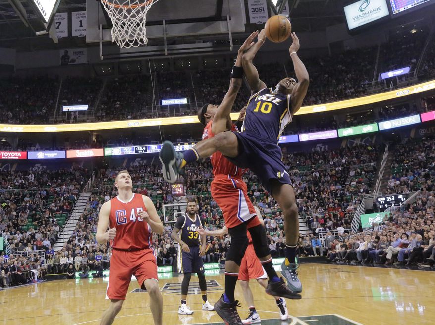 FILE - This Dec. 26, 2015, file photo, Los Angeles Clippers forward Paul Pierce, center, fouls Utah Jazz guard Alec Burks (10) during the second half of an NBA basketball game, in Salt Lake City. Burks injured his leg after falling following the foul. Burks is the third major contributor for the Jazz who has been lost for a significant amount of time this season. Starting center Rudy Gobert remains out with a sprained MCL. Starting point guard Dante Exum is out for the season with a torn ACL. (AP Photo/Rick Bowmer, File)