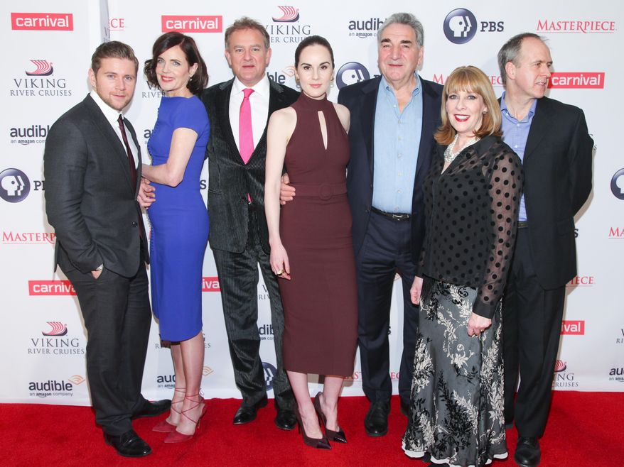 FILE - In this Dec. 7, 2015 file photo, Allen Leech, from left, Elizabeth McGovern, Hugh Bonneville, Michelle Dockery, Jim Carter, Hugh Bonneville, Phyllis Logan and Kevin Doyle attend a "Downton Abbey" cast photo call at the Millennium Hotel, in New York. "Downton Abbey" cast members made the most of their characters. But it was the smart dialogue crafted by Julian Fellowes, who wrote every episode in the drama's six seasons, that put PBS’ "Downton" in a TV class of its own. "Downton" returns for its sixth and final season, Sunday, Jan. 3, 2016, at 9 p.m. EST on PBS. (Photo by Andy Kropa/Invision/AP, File)