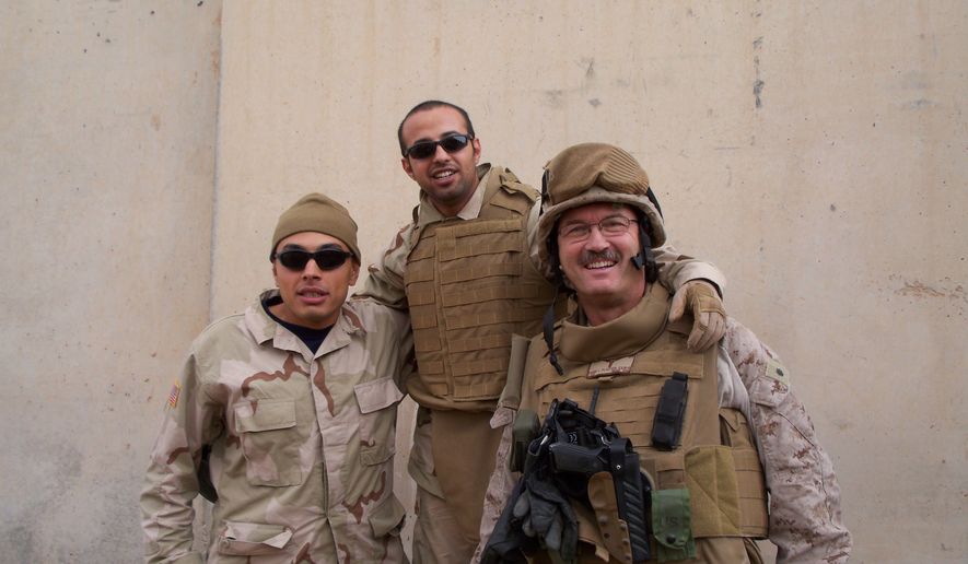 During his second tour in Iraq in 2008, Mark Plaster (right) met a young Iraqi interpreter, &quot;Alex&quot; (left). Mr. Plaster has been an emergency room doctor and a lawyer, served two tours of duty in Iraq, founded three medical magazines — and once saved Joseph R. Biden&#39;s life. Now he wants to defy the odds and win a congressional seat as a Republican in Maryland. (Associated Press)