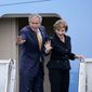 U.S. President George W. Bush and first lady Laura Bush wave as they board Air Force One to depart from RAF Aldergrove in Belfast, Northern Ireland, Monday, June 16, 2008. (AP Photo/Michael Cooper)