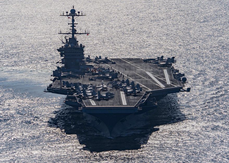 In this Friday, Dec. 25, 2015 photo released by the U.S. Navy, the aircraft carrier USS Harry S. Truman navigates the Gulf of Oman. Iranian naval vessels conducted rocket tests last week near the USS Harry S. Truman aircraft carrier, the USS Bulkeley destroyer and a French frigate, the FS Provence, and commercial traffic passing through the Strait of Hormuz, the American military said Wednesday, Dec. 30, 2015 causing new tension between the two nations after a landmark nuclear deal. (Mass Communication Specialist 3rd Class J. M. Tolbert/ U.S. Navy via AP) MANDATORY CREDIT