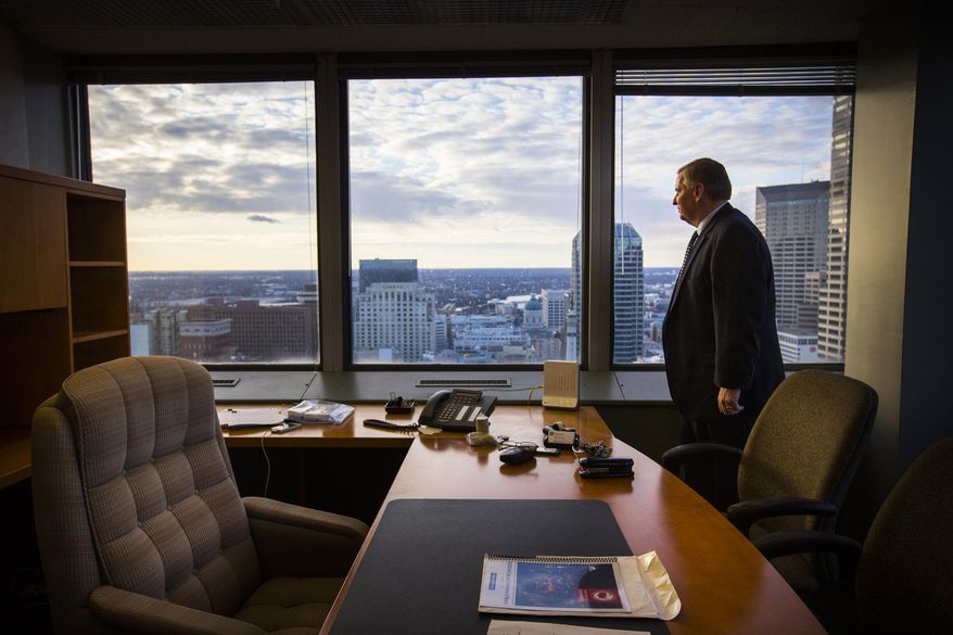 In this Dec. 18, 2015 photo, Indianapolis Mayor Greg Ballard poses for a portrait inside his office inside in Indianapolis. Ballard is ending eight years as Indianapolis mayor, capping a period during which he oversaw the city's hosting of the 2012 Super Bowl while also struggling with persistent violent crime problems. (Mykal McEldowney/The Star via AP)