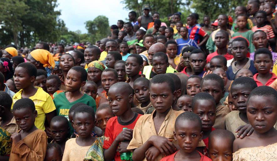 In this photo taken on Tuesday, Dec. 29 2015, Burundian refugees attend a rally addressed by Tanzania Prime Minister Kassim Majaliwa, at Nduta refugee camp in Kigoma, Tanzania. Burundi&#39;s President Pierre Nkurunziza threatened on Wednesday, Dec. 30 to fight any African Union peacekeepers imposed on his country, in his most confrontational comments yet on a mounting political crisis. The African Union said this month it was ready to send 5,000 peacekeepers to protect civilians caught up in months of violence, invoking for the first time powers to intervene in a member state against its will.  (AP Photo)