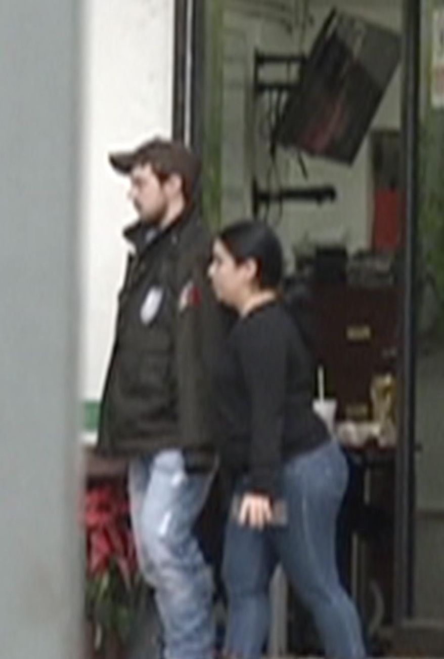 In this frame from Dec. 30, 2015 video provided by TVAzteca, Ethan Couch, left, is led through a detention center in Guadalajara, Mexico. The mother of the fugitive Texas teen known for using an "affluenza" defense in a fatal drunken-driving accident will likely remain jailed for several days in Los Angeles after being deported from Mexico, investigators said Thursday. Tonya Couch and her 18-year-old, Ethan, were taken into custody this week in Mexico, where authorities believe the pair fled in November as Texas prosecutors investigated whether he had violated his probation. (TV Azteca via AP) MANDATORY CREDIT; MEXICO OUT ; NO PUBLICAR EN MEXICO
