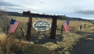 A private sign welcomes visitors to the Diamond Valley, part of the Harney Basin in southeast Oregon, in mid-December 2015. The valley is home to large cattle ranches that rely on both private and public land for grazing. The prosecution of Dwight and Steven Hammond for burning public lands has brought fresh focus to the debate over how federal land is managed. (Les Zaitz/The Oregonian via AP)