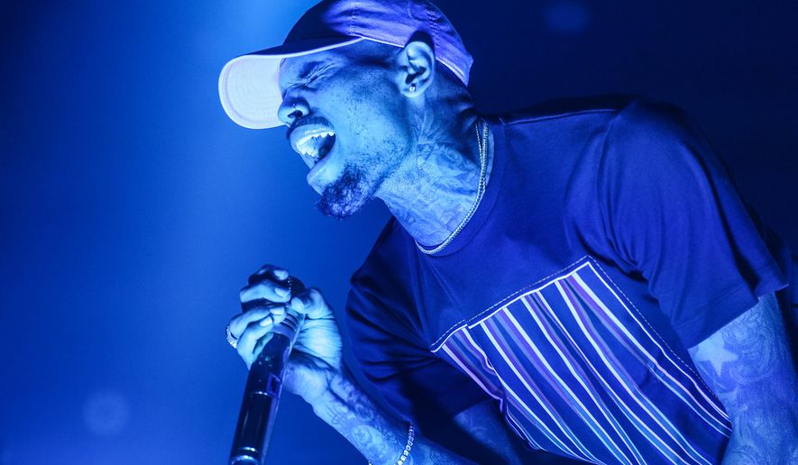 FILE - In this Friday, Dec. 18, 2015 file photo, Chris Brown performs at the Hollywood Palladium in Los Angeles. Las Vegas police are investigating an allegation of battery against R&B singer Chris Brown. Lt. Jeff Goodwin said authorities received a call Saturday, Jan. 2, 2016, about the alleged battery at the Palms Casino Resort. (Photo by Rich Fury/Invision/AP, File)