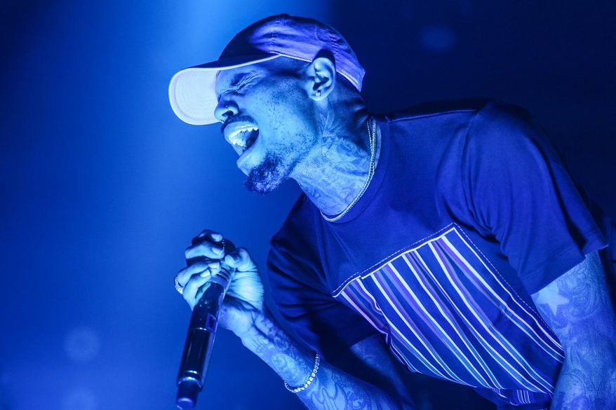 FILE - In this Friday, Dec. 18, 2015 file photo, Chris Brown performs at the Hollywood Palladium in Los Angeles. Las Vegas police are investigating an allegation of battery against R&B singer Chris Brown. Lt. Jeff Goodwin said authorities received a call Saturday, Jan. 2, 2016, about the alleged battery at the Palms Casino Resort. (Photo by Rich Fury/Invision/AP, File)