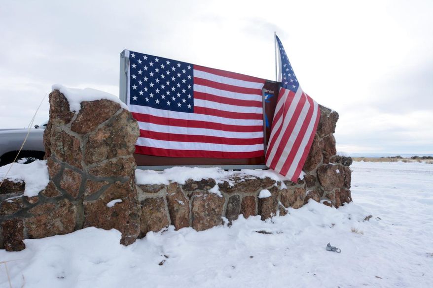 A small group of militia in Burns, Ore., who were there to support a local ranching family, took over the federal office of the Malheur National Wildlife Refuge headquarters Saturday, Jan. 3, 2016, in a development that stunned the community. Armed protesters took over the Malheur National Wildlife Refuge on Saturday after participating in a peaceful rally over the prison sentences of local ranchers Dwight and Steven Hammond. (Mark Graves/The Oregonian via AP) **FILE**