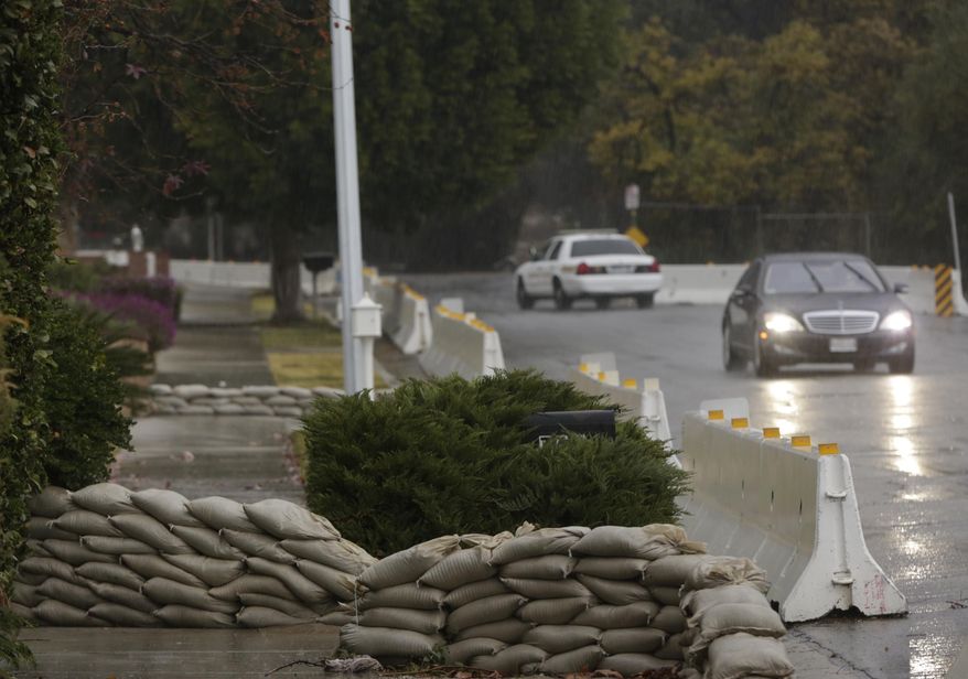 Concrete barriers are set to protect homes from flash flooding in Glendora, Calif., on Tuesday, Jan. 5, 2016. Persistent wet conditions could put some Los Angeles County communities at risk of flash flooding along with mud and debris flows, especially in wildfire burn areas. El Nino storms lined up in the Pacific, promising to drench parts of the West for more than two weeks and increasing fears of mudslides and flash floods in regions stripped bare by wildfires. (AP Photo/Damian Dovarganes)