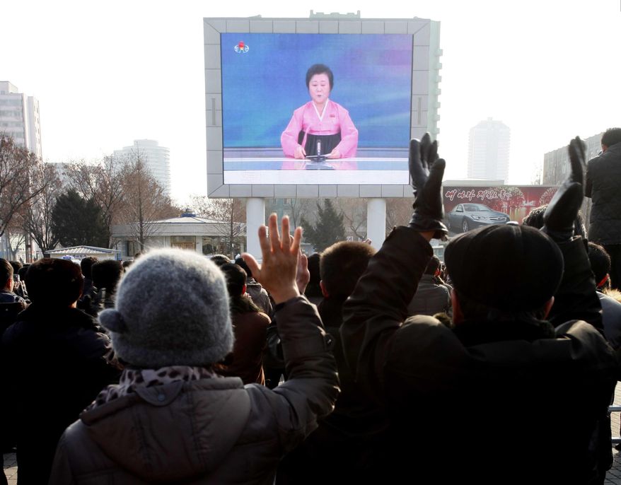 North Koreans watch a news broadcast on a video screen outside Pyongyang Railway Station in Pyongyang, North Korea, Wednesday, Jan. 6, 2016. North Korea said Wednesday it had conducted a hydrogen bomb test, a defiant and surprising move that, if confirmed, would put Pyongyang a big step closer toward improving its still-limited nuclear arsenal. (AP Photo/Kim Kwang Hyon)
