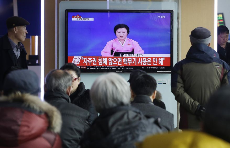 People watch a TV news program showing North Korea's announcement, at the Seoul Railway Station in Seoul, South Korea, Wednesday, Jan. 6, 2016. North Korea said Wednesday it had conducted a hydrogen bomb test, a defiant and surprising move that, if confirmed, would put Pyongyang a big step closer toward improving its still-limited nuclear arsenal. The letters read " Will not use nuclear weapon if autonomy secured." (AP Photo/Ahn Young-joon)