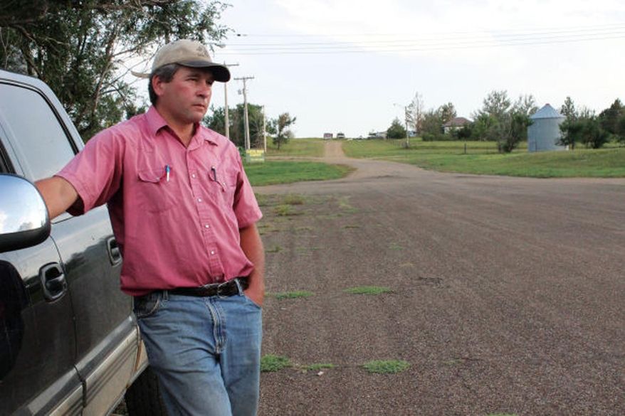 FILE - This Oct. 13, 2013 file photo provided by Alex Skalicky shows Ryan Schock, the mayor of Leith, N.D. Schock is scheduled to go on trial Tuesday, Jan. 12, 2016, in Carson, N.D., for burning a building once owned by white supremacist Craig Cobb. Schock is accused of acting recklessly and not alerting authorities when the fire spread. He maintains he was just trying to clean up the community after Cobb's departure following his failed attempt to turn the town into an Aryan enclave. (Alex Skalicky via AP, File)
