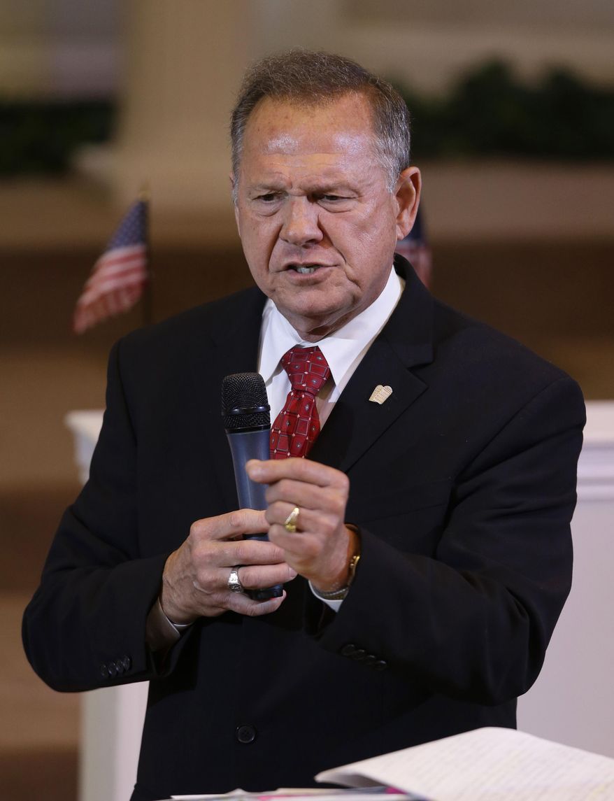 FILE - In this June 28, 2015, file photo, Alabama Supreme Court Chief Justice Roy Moore speaks to the congregation of Kimberly Church of God in Kimberly, Ala. Moore continues to fight against gay marriage in the state, suggesting on Wednesday, Jan. 6, 2016, that Alabama probate judges should refuse to issue marriage licenses to gay couples despite the U.S. Supreme Court ruling in June 2015 that effectively legalized same-sex marriage throughout the country. (AP Photo/Butch Dill, File)