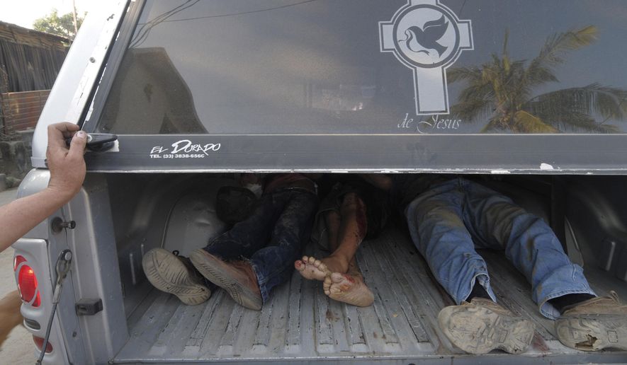 FILE - In this Dec. 5, 2010 file photo, the bodies of three men lie in the back of a funeral home's pick-up truck after they were killed by unidentified gunmen in the Pacific resort city of Acapulco, Mexico. A new study published on Tuesday, Jan. 5, 2016 in the American journal Health Affairs suggests that Mexico's drug violence was so bad at its peak, from 2005-2010, that it apparently caused the nation's male life expectancy to drop by several months. (AP Photo/Bernandino Hernandez, File)