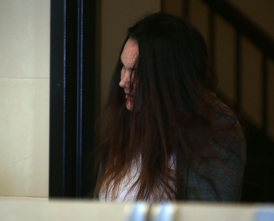 Rachelle Bond arrives in Suffolk Superior Court, to appear before Magistrate Edward J. Curley, on Wednesday, Jan. 6, 2016 in Boston, Mass. According to the Suffolk County District Attorney's Office, Bond was arraigned Wednesday on charges she helped her boyfriend conceal the body of her daughter, Bella. Bond, mother of a 2-year-old girl dubbed Baby Doe after her body washed up on a Boston Harbor island inside a bag, pleaded not guilty to an accessory charge connected to the toddler's death. Michael McCarthy was charged with first-degree murder and will be arraigned Monday. (Pat Greenhouse/The Boston Globe via AP, Pool)