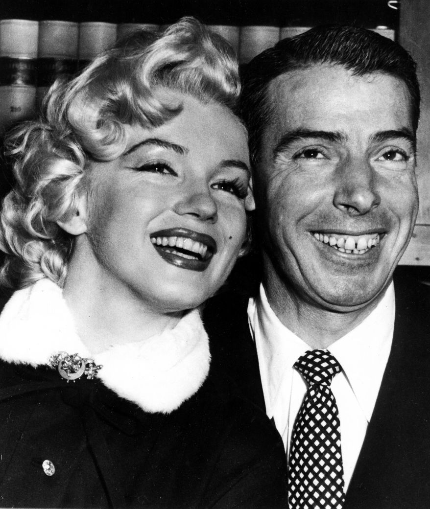 FILE - In this Jan. 14, 1954 file photo, New York Yankees' Joe Dimaggio, right, poses with actress Marilyn Monroe, as they wait for their marriage ceremony in San Francisco. “Insignificance” a play that depicts what it might have been like had Marilyn Monroe, Joe DiMaggio, Albert Einstein and Senator Joe McCarthy met in a hotel room in 1953 will make its New York debut next month in a hotel room. (AP Photo, File)