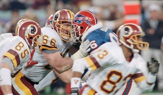 Washington Redskins&#x27; Joe Jacoby (66) butts heads at the line with Bills Leon Seals during Super Bowl XXVI against the Buffalo Bills, Sunday, Jan. 27, 1992 in Minneapolis. The 310 pound offensive tackle is one of the players responsible for the Redskins successful 1991 season and Super XXVI victory over the Bills. (AP Photo/Rusty Kennedy) **FILE**