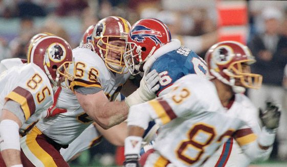 Washington Redskins&#39; Joe Jacoby (66) butts heads at the line with Bills Leon Seals during Super Bowl XXVI against the Buffalo Bills, Sunday, Jan. 27, 1992 in Minneapolis. The 310 pound offensive tackle is one of the players responsible for the Redskins successful 1991 season and Super XXVI victory over the Bills. (AP Photo/Rusty Kennedy) **FILE**