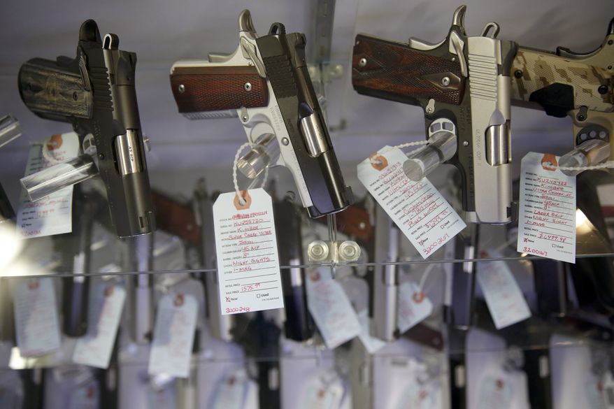 Handguns are displayed at Metro Shooting Supplies in Bridgeton, Mo. (Associated Press)
