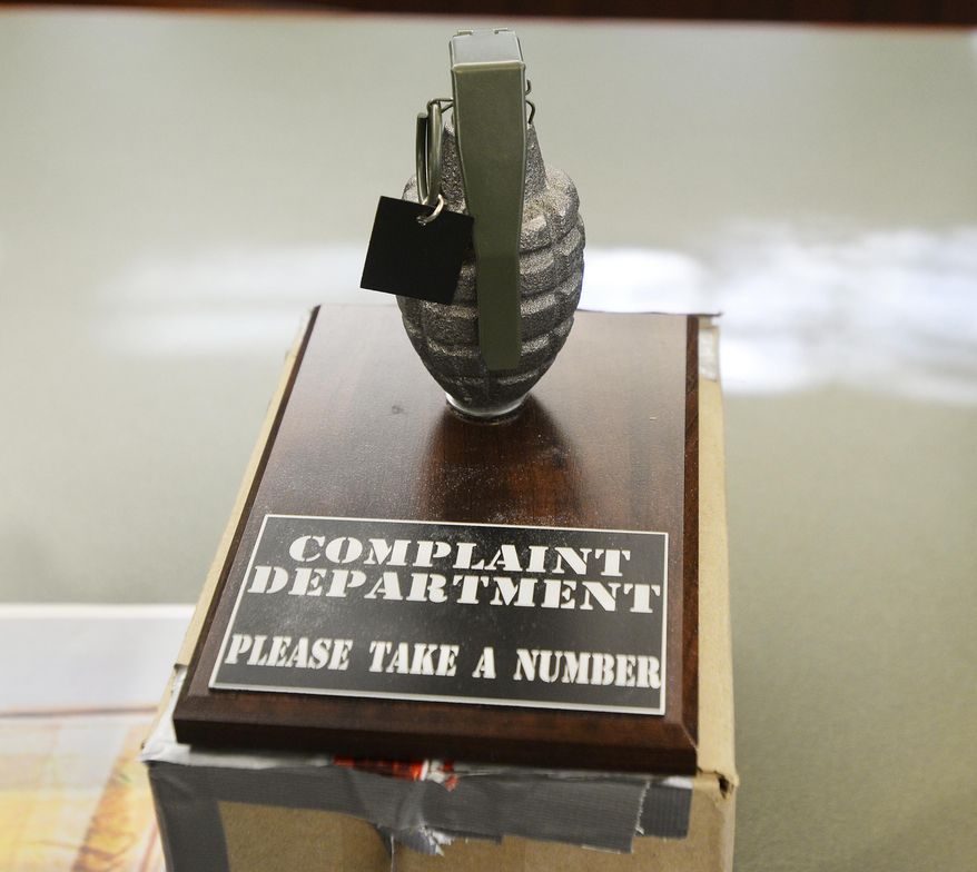 A novelty gift of a hand grenade, sent to Beaver County Sheriff Tony Guy is displayed during a news conference, Thursday, Jan. 7, 2016, at the Beaver County Courthouse in Beaver, Pa. Sheriff Guy ordered the county courthouse evacuation as a precaution the day before after the box addressed to him was X-rayed showing a grenade shape along with other incoming mail. (Sally Maxson/Beaver County Times via AP) MANDATORY CREDIT