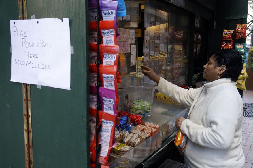 A woman purchase Powerball lottery tickets from a newsstand Wednesday, Jan. 6, 2016, in Philadelphia. Players will have a chance Wednesday night at the biggest lottery prize in nearly a year.  (AP Photo/Matt Rourke)