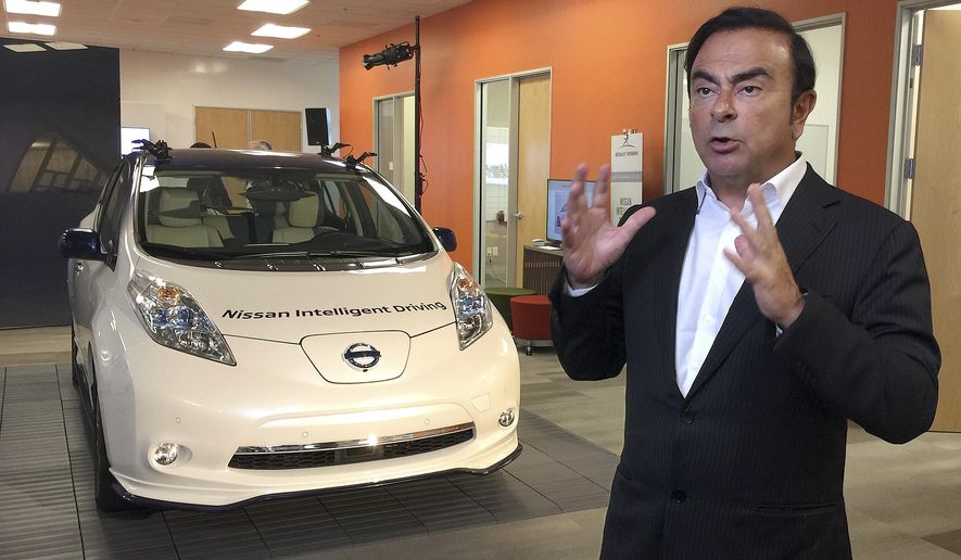Carlos Ghosn, chairman and CEO of Nissan, speaks next to a prototype of the autonomous driving Nissan Leaf at Renault-Nissan Silicon Valley in Sunnyvale, Calif., Thursday, Jan. 7, 2016. The Renault-Nissan Alliance is entering the race to build autonomous cars with a plan to introduce 10 models capable of temporarily relieving humans of their driving duties on highways and city streets. (AP Photo/Terry Chea)