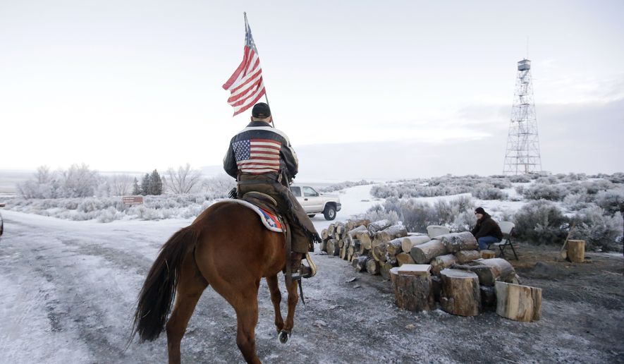 Cowboy Dwane Ehmer, of Irrigon Ore., a supporter of the group occupying the Malheur National Wildlife Refuge, rides his horse at Malheur National Wildlife Refuge Friday, Jan. 8, 2016, near Burns, Ore. Three Oregon sheriffs met with leaders of an armed group to try to persuade them to end their occupation of the federal wildlife refuge after many local residents made it plain that&#39;s what they want. (AP Photo/Rick Bowmer)