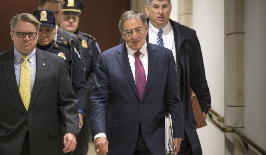 Former Defense Secretary Leon Panetta, center, is escorted to a secure floor on Capitol Hill in Washington, Friday, Jan. 8, 2016, to be questioned in a closed-door hearing of the House Benghazi Committee. The panel, chaired by Rep. Trey Gowdy, R-S.C., is investigating the 2012 attacks on the U.S. consulate in Benghazi, Libya, where a violent mob killed four Americans, including Ambassador Christopher Stevens. (AP Photo/J. Scott Applewhite)