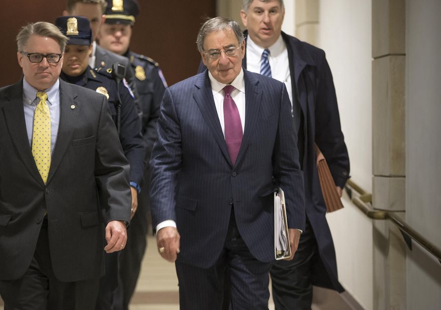 Former Defense Secretary Leon Panetta, center, is escorted to a secure floor on Capitol Hill in Washington, Friday, Jan. 8, 2016, to be questioned in a closed-door hearing of the House Benghazi Committee. The panel, chaired by Rep. Trey Gowdy, R-S.C., is investigating the 2012 attacks on the U.S. consulate in Benghazi, Libya, where a violent mob killed four Americans, including Ambassador Christopher Stevens. (AP Photo/J. Scott Applewhite)