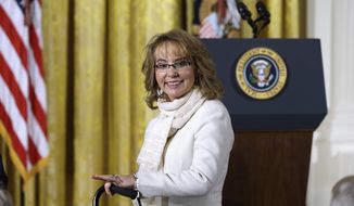 In this file photo from Tuesday, Jan. 5, 2016,  former Arizona Rep. Gabby Giffords arrives in the East Room of the White House in Washington to hear President Obama speak about steps his administration is taking to reduce gun violence. In past five years, Giffords has hiked the Grand Canyon, raced in a 40-mile bike ride, sky dived and founded an advocacy group that helped convince President Obama to take executive action on gun control. (AP Photo/Carolyn Kaster)