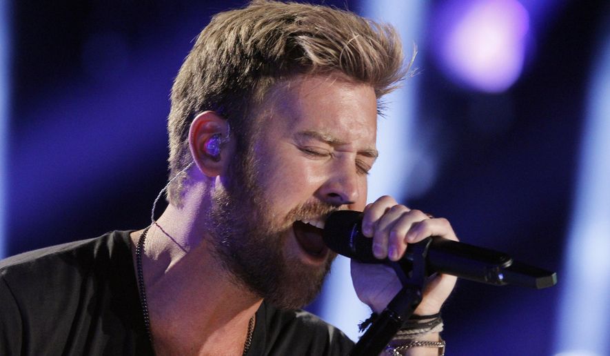 In this June 8, 2014, file photo, Charles Kelley of Lady Antebellum performs during the CMA Fest at LP Field in Nashville, Tenn. Kelley in February 2016 is expecting his first child and releasing his first solo record apart from the country vocal group Lady Antebellum. (Photo by Wade Payne/Invision/AP, File)