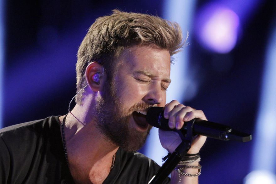 In this June 8, 2014, file photo, Charles Kelley of Lady Antebellum performs during the CMA Fest at LP Field in Nashville, Tenn. Kelley in February 2016 is expecting his first child and releasing his first solo record apart from the country vocal group Lady Antebellum. (Photo by Wade Payne/Invision/AP, File)
