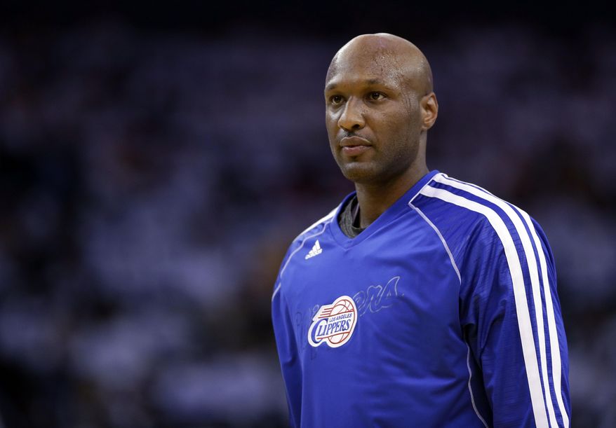 FILE - This Jan. 2, 2013, file photo shows Los Angeles Clippers' Lamar Odom during an NBA basketball game against the Golden State Warriors in Oakland, Calif. Odom has been transferred from a Los Angeles hospital to a private facility. But there's no word on his condition, three months after he was found unconscious and in critical condition at a Nevada brothel. Family spokeswoman Alvina Alston says Friday, Jan. 8, 2016 that Odom was released from the hospital earlier in the week. (AP Photo/Marcio Jose Sanchez, File)