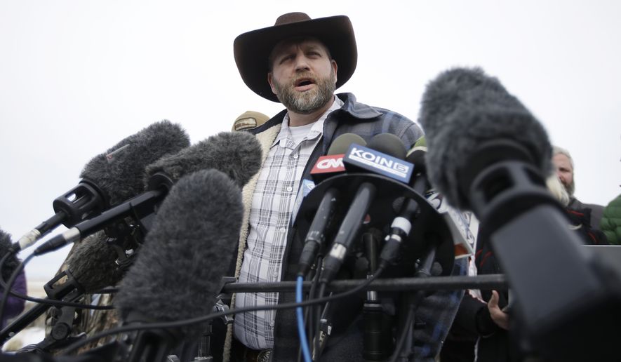Ammon Bundy, despite leading an armed group occupying a national wildlife refuge in Oregon, says his siege will ultimately serve to head off violent conflict with the government. (Associated Press)
