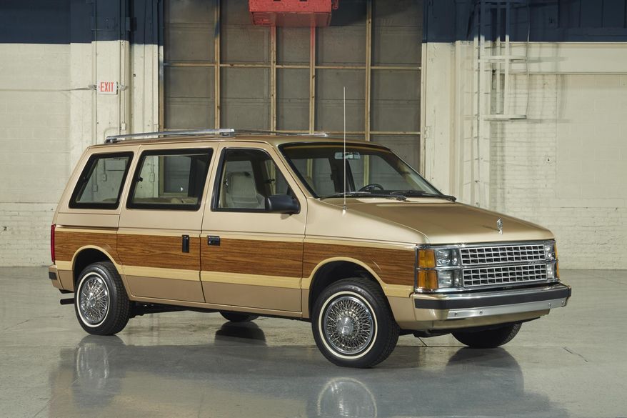 This photo provided by Fiat Chrysler Automobiles shows the 1984 Dodge Caravan minivan. Chrysler introduced the minivan 33 years ago, and it took the suburbs by storm. The sliding doors and roomy interior in the Chrysler Town and Country and the Dodge Caravan were perfect for shuttling kids and their sports gear. (Courtesy of Fiat Chrysler Automobiles)