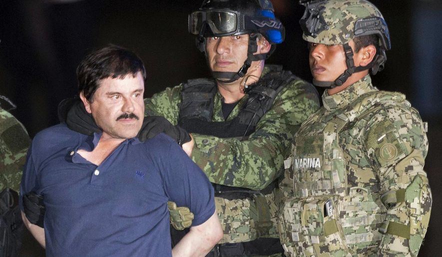 In this Friday, Jan. 8, 2016 photo, Joaquin &amp;quot;El Chapo&amp;quot; Guzman is made to face the press as he&#39;s escorted to a helicopter in handcuffs by soldiers and marines at a federal hangar in Mexico City. Guzman&#39;s second prison escape in 2015 from a top security prison though a tunnel had embarrassed President Enrique Pena Nieto and made his capture a national priority. (AP Photo/Eduardo Verdugo)