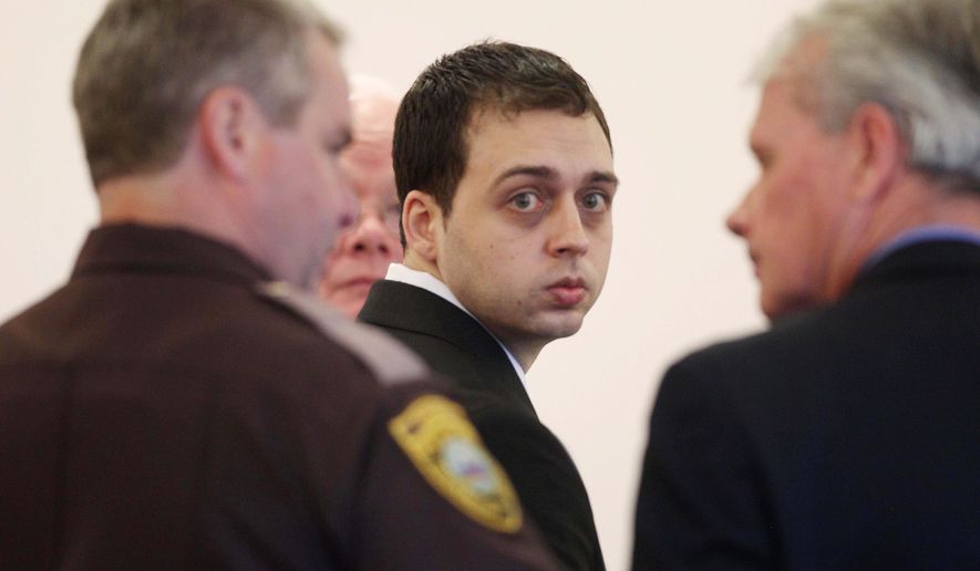 FILE - In this Tuesday June 10, 2014 file photo, Roland Dow, center, is seen during his trial in Rockingham County Superior Court in Brentwood, N.H. Dow was convicted of severely beating and burning his girlfriend's 3-year-old son. The New Hampshire Supreme Court on Tuesday Jan. 12, 2016 upheld the conviction of Dow. (AP Photo/Jim Cole, File)